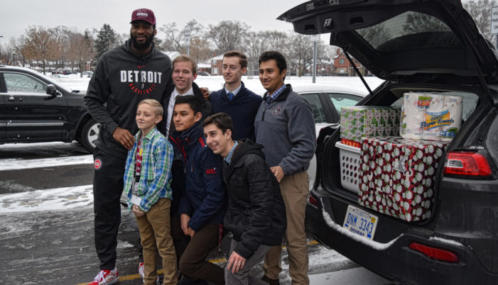 U of D Jesuit students team up with Pistons’ Andre Drummond to adopt 42 Detroit families for Christmas