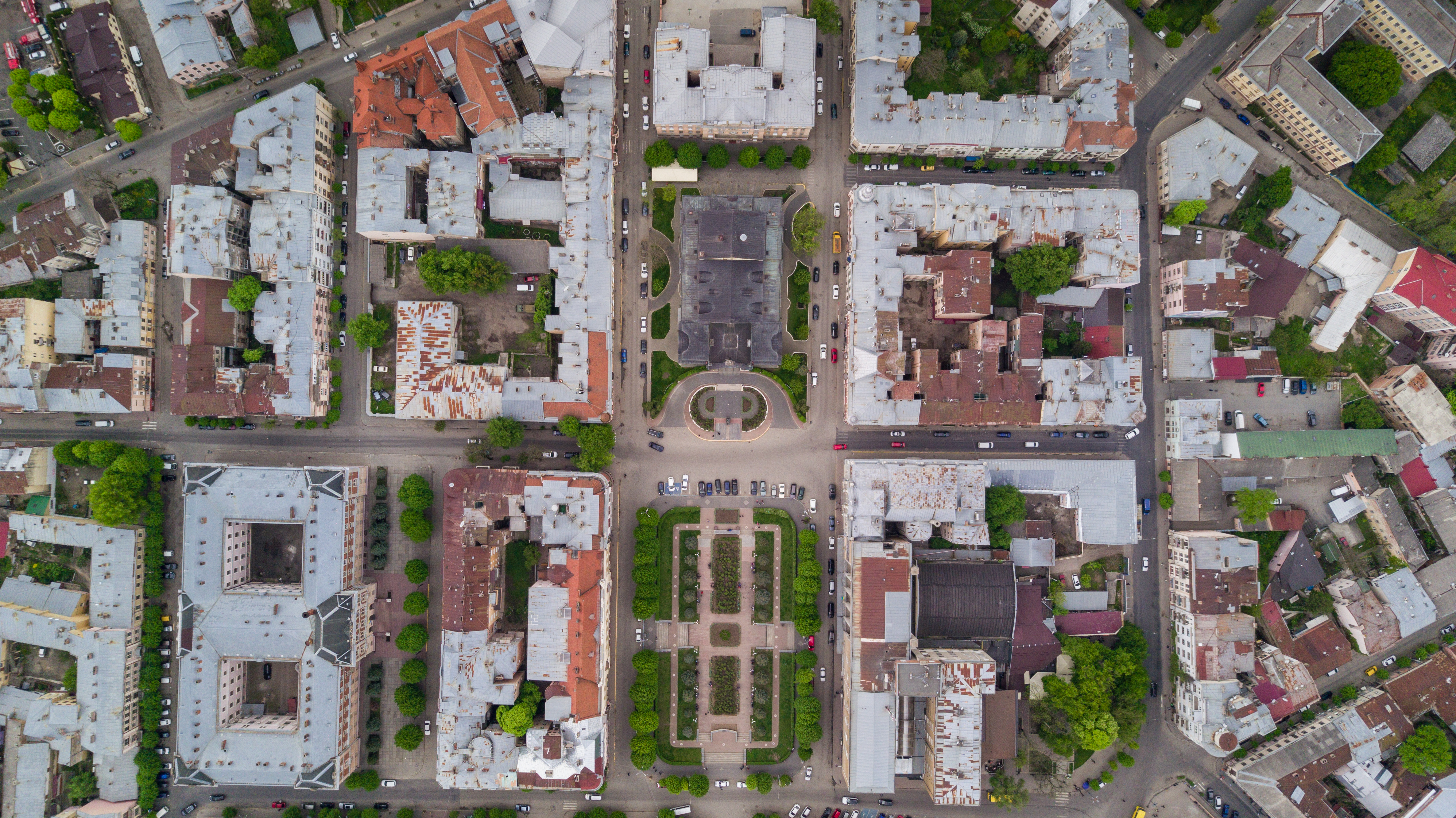Aerial summer view of central part of beautiful ancient ukrainian city Chernivtsi with its streets, old residential buildings, town hall, churches etc. Beautiful town. UNESCO world heritage site.